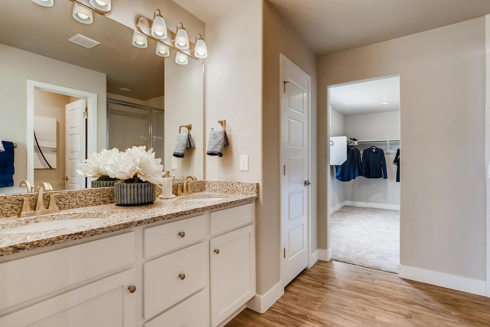 A bathroom with a marble countertop.