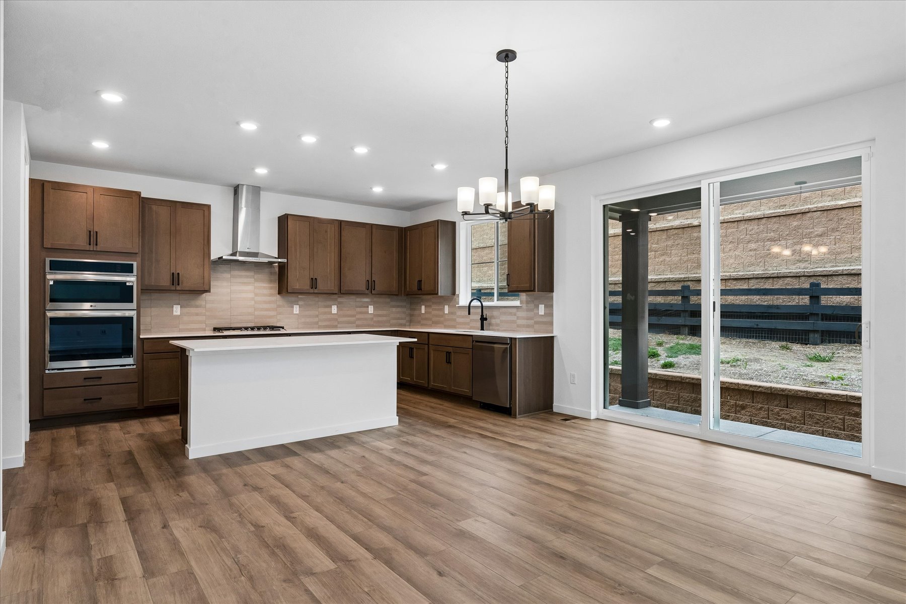A kitchen with wooden cabinets.