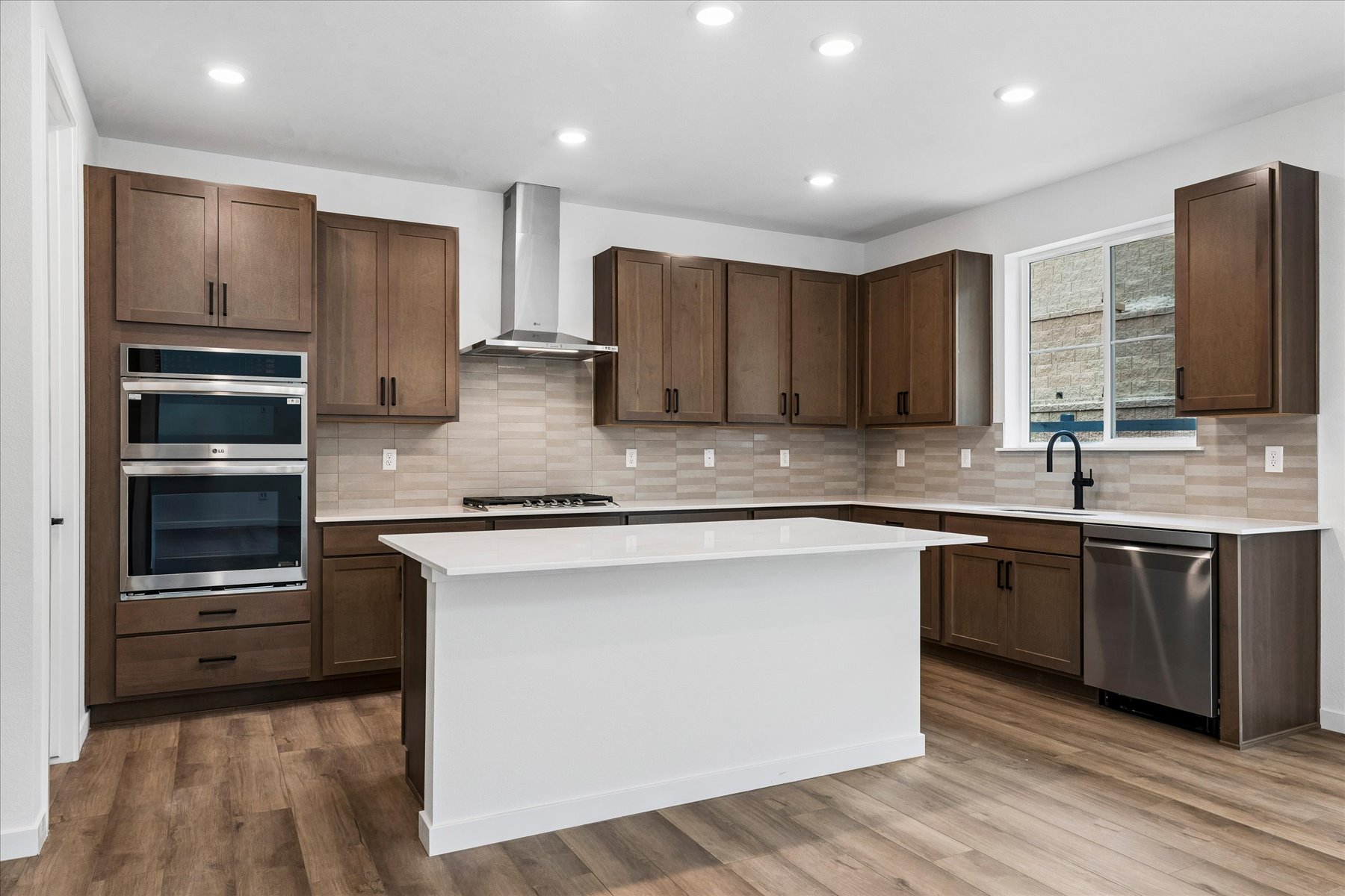 A kitchen with wooden cabinets.