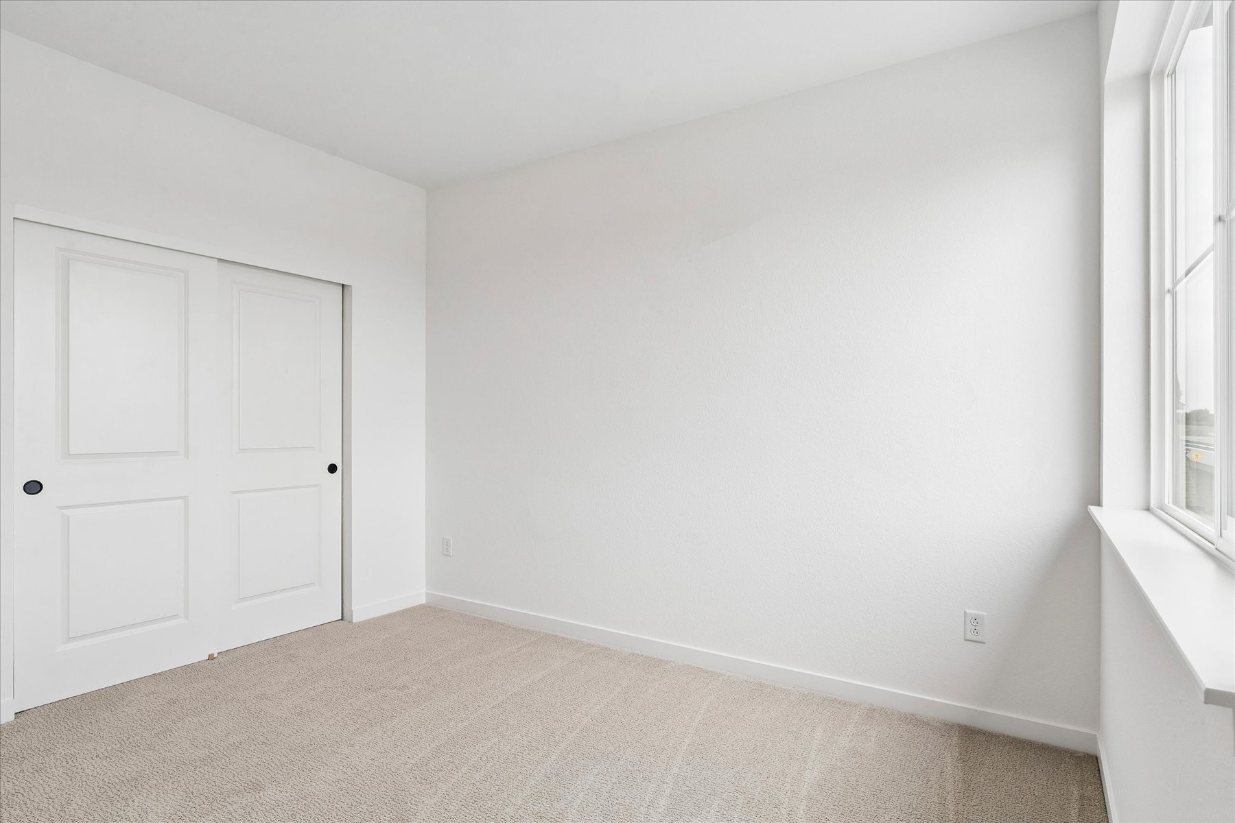 A room with white doors.