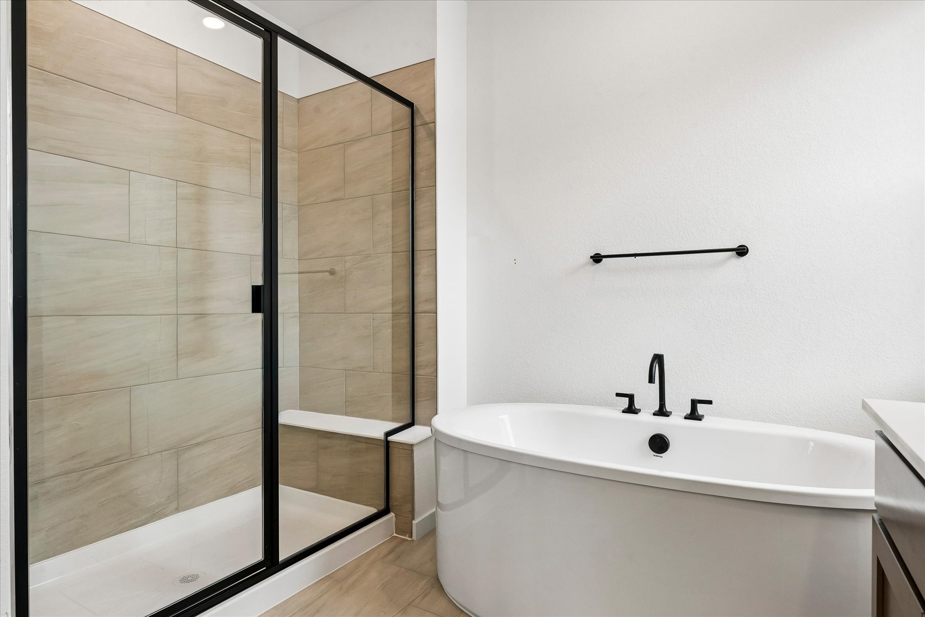 A bathroom with a glass shower.