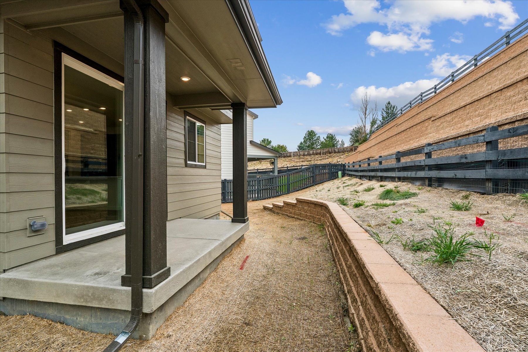 A building with a fence and a walkway.