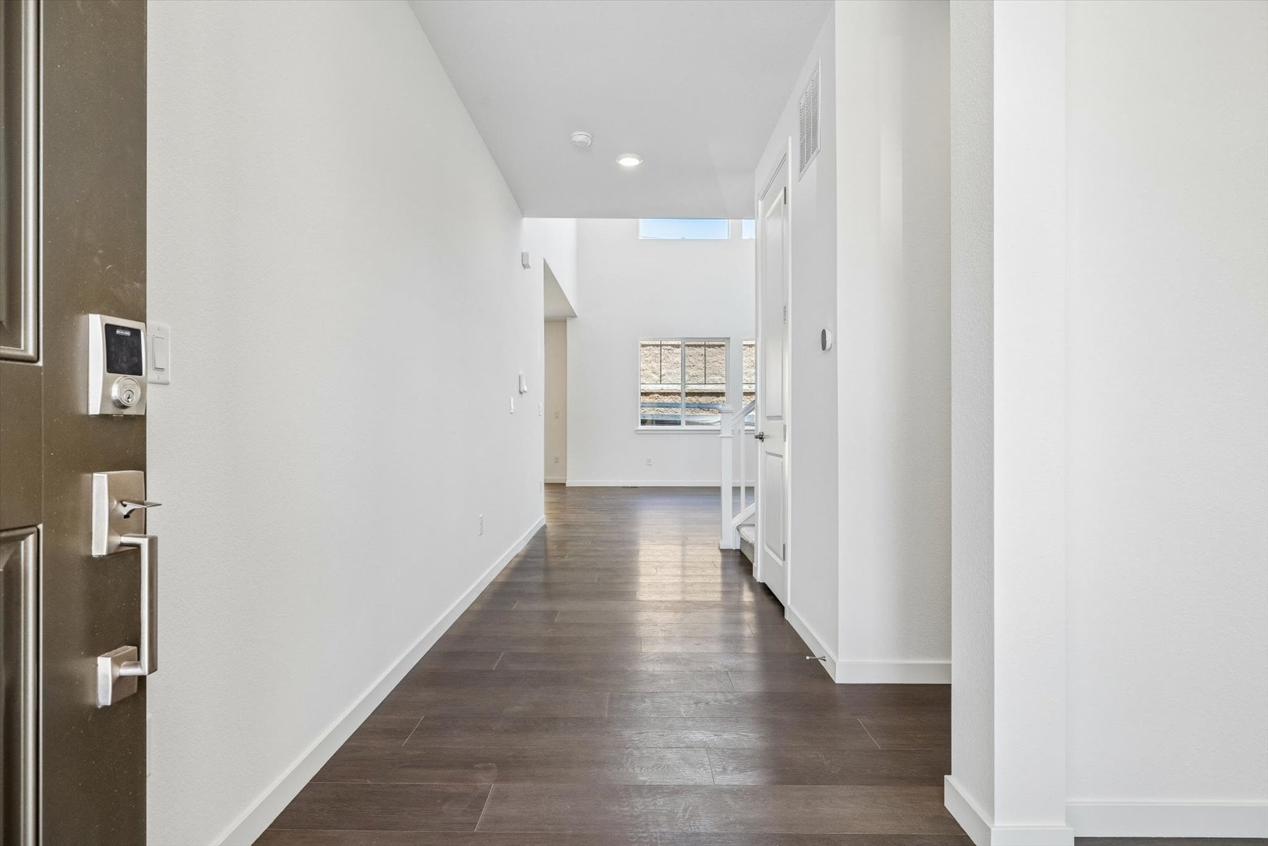 A hallway with white walls.