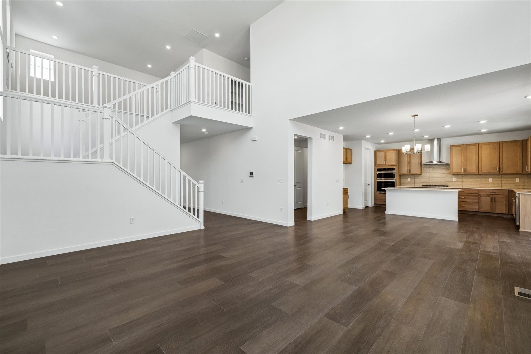 A large white staircase in a house.