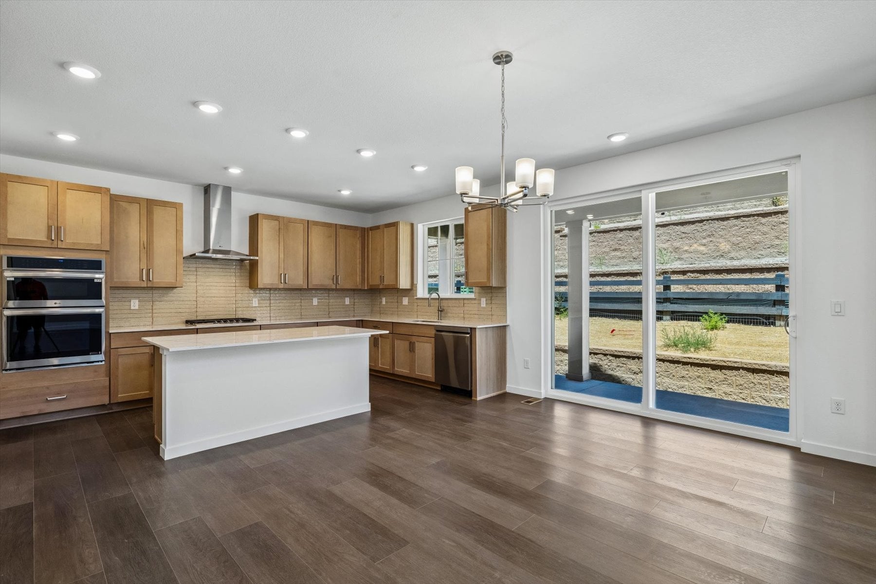 A kitchen with wooden cabinets.
