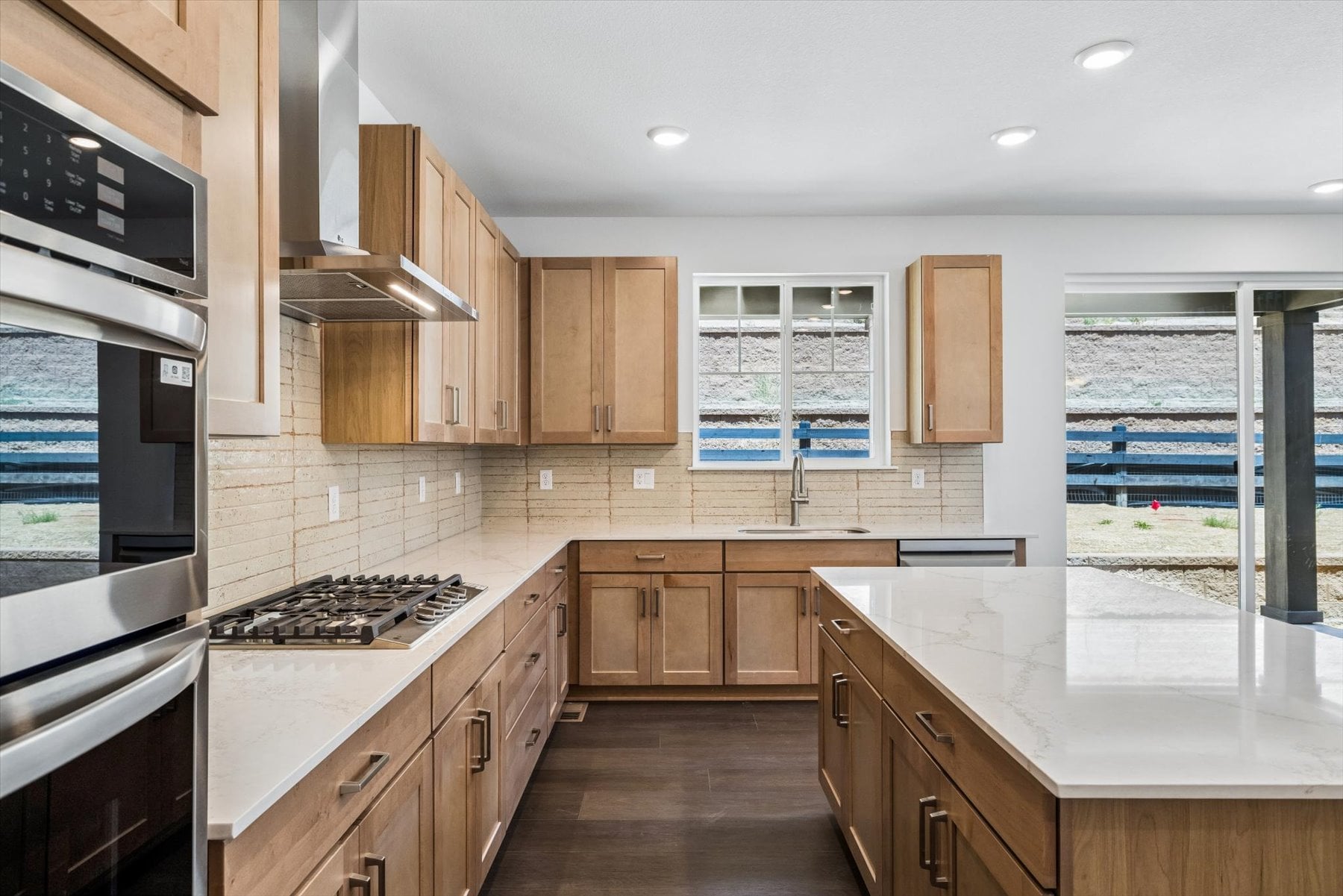 A kitchen with wooden cabinets.