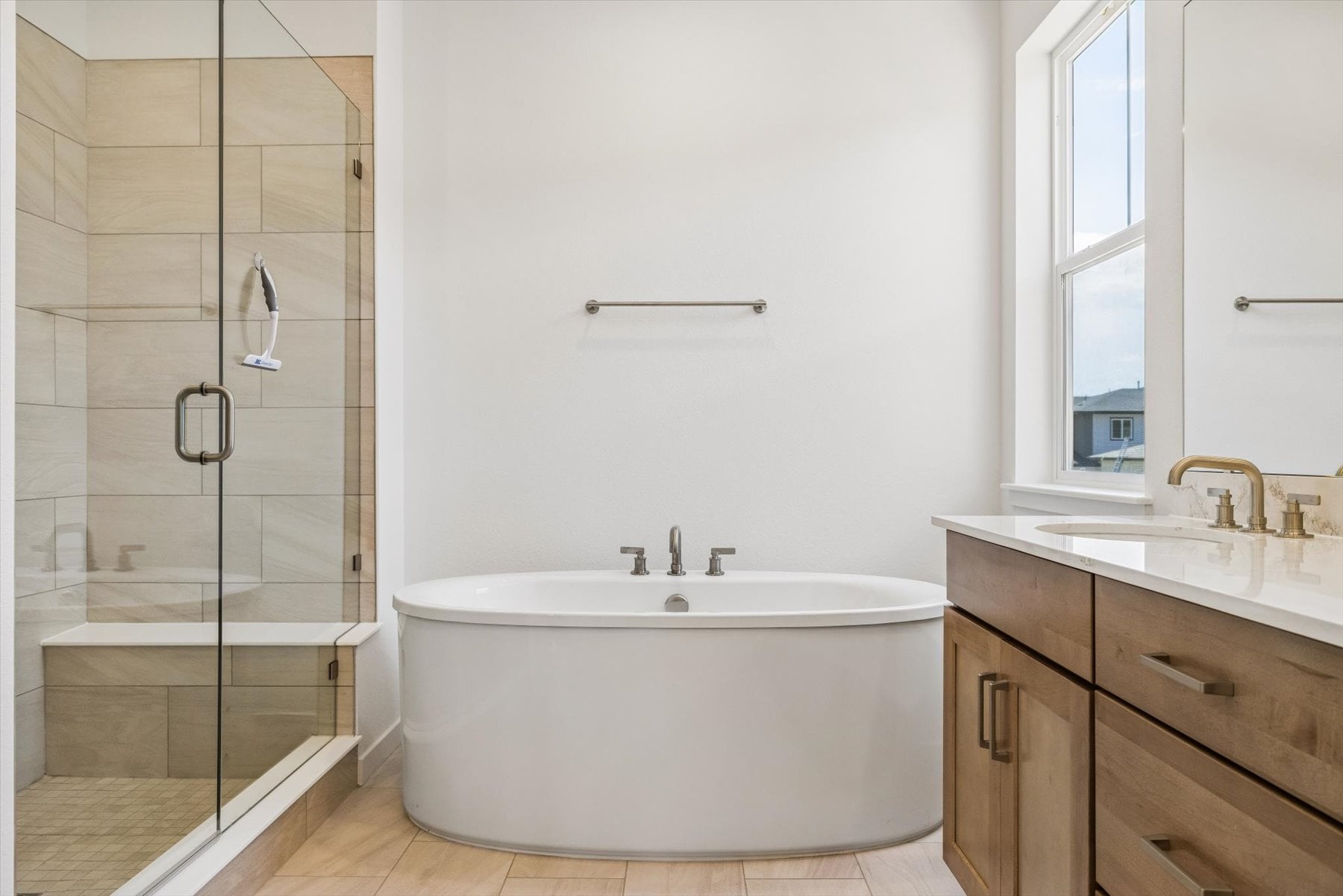 A bathroom with a tub and sink.
