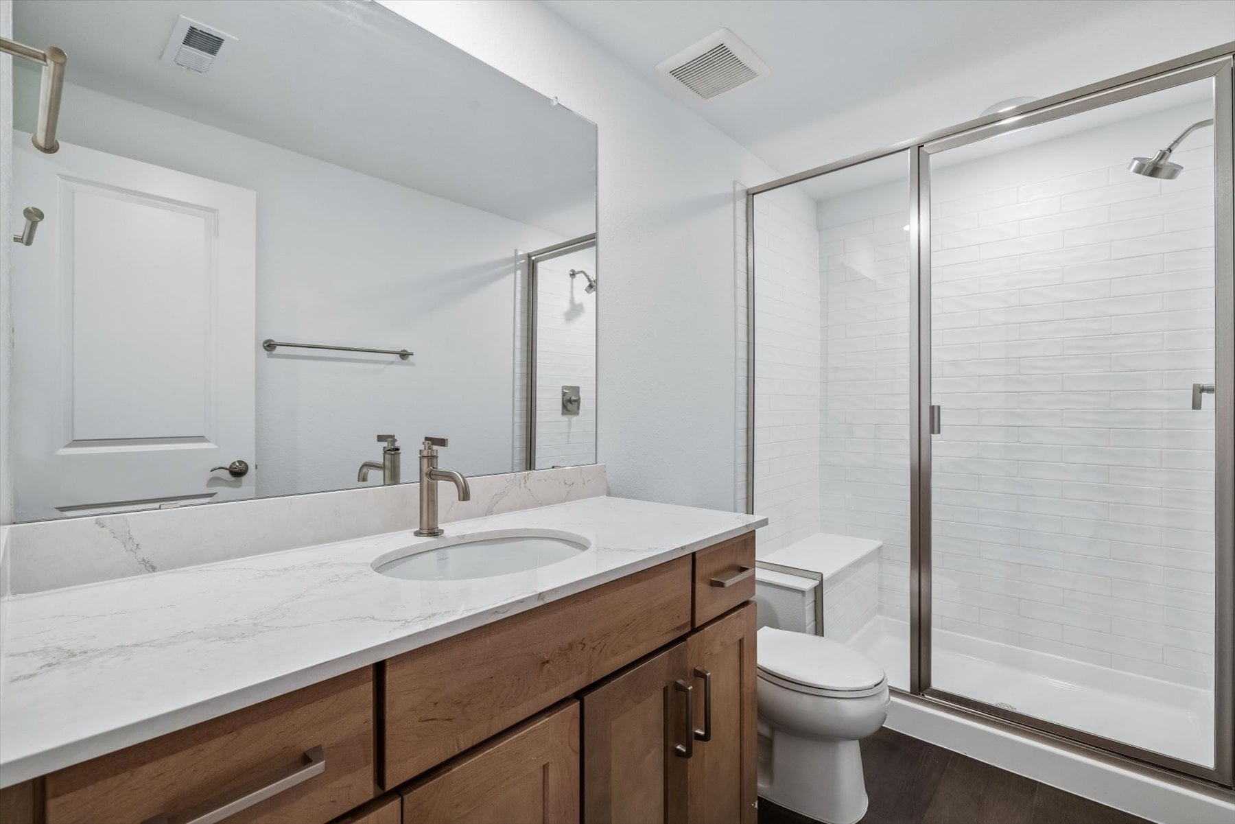 A bathroom with a glass shower.
