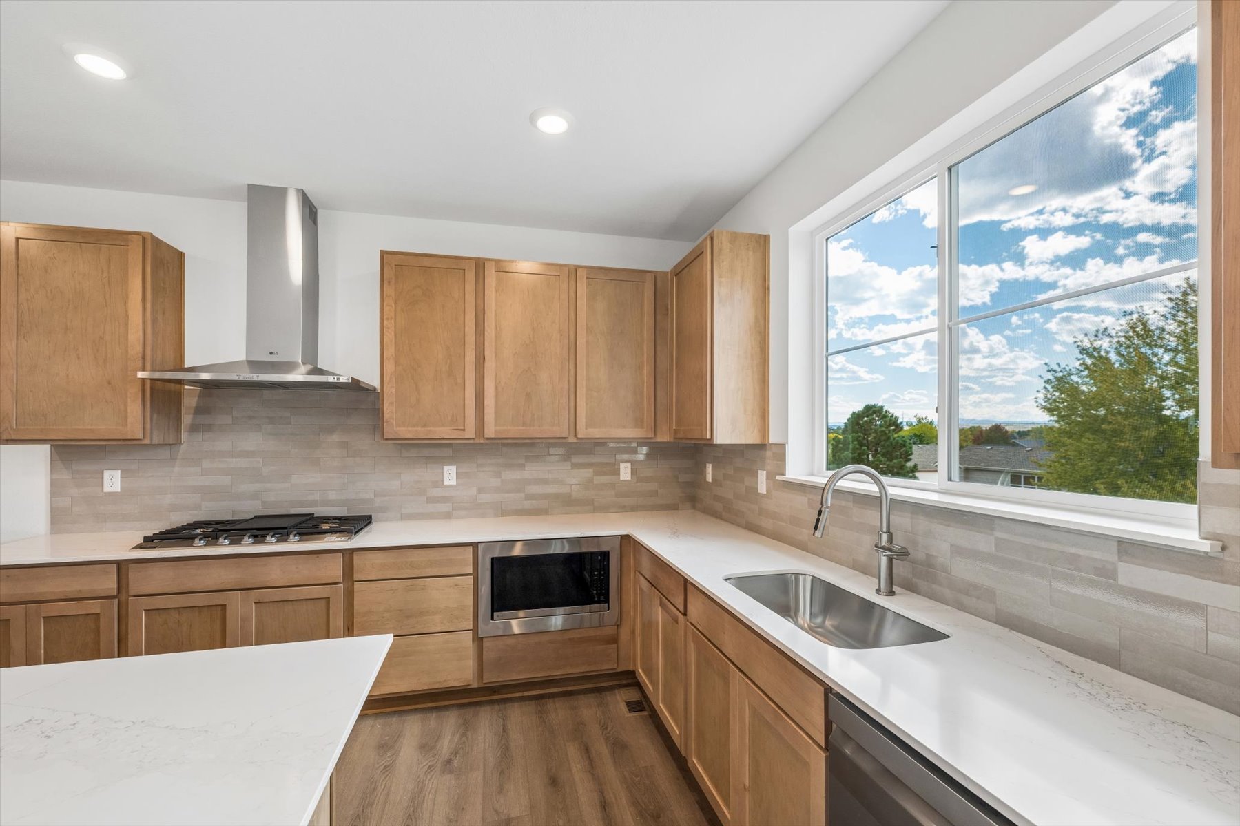 A kitchen with wooden cabinets.