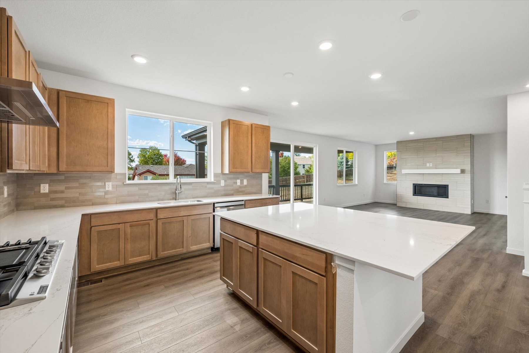 A kitchen with wooden cabinets.