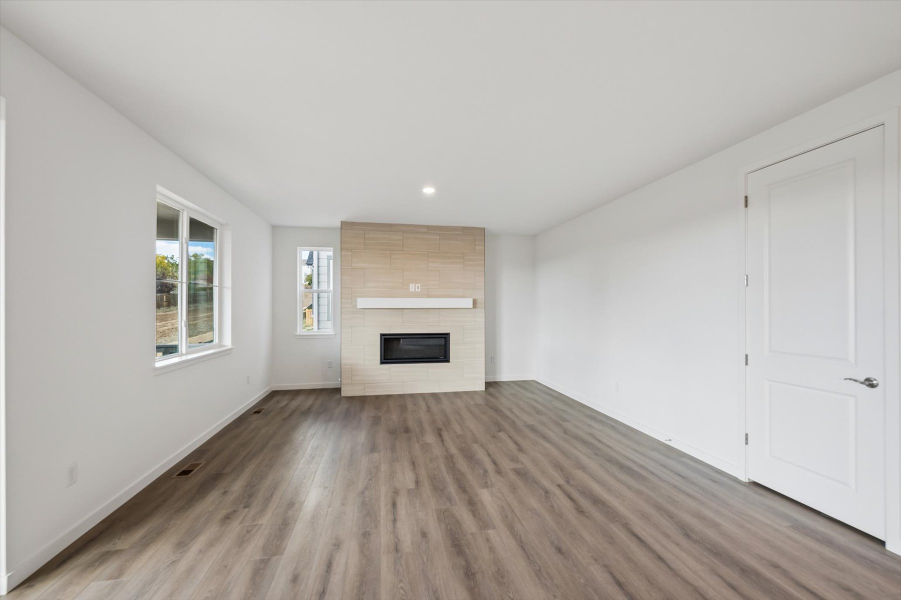 A room with a wood floor and a wood floor.