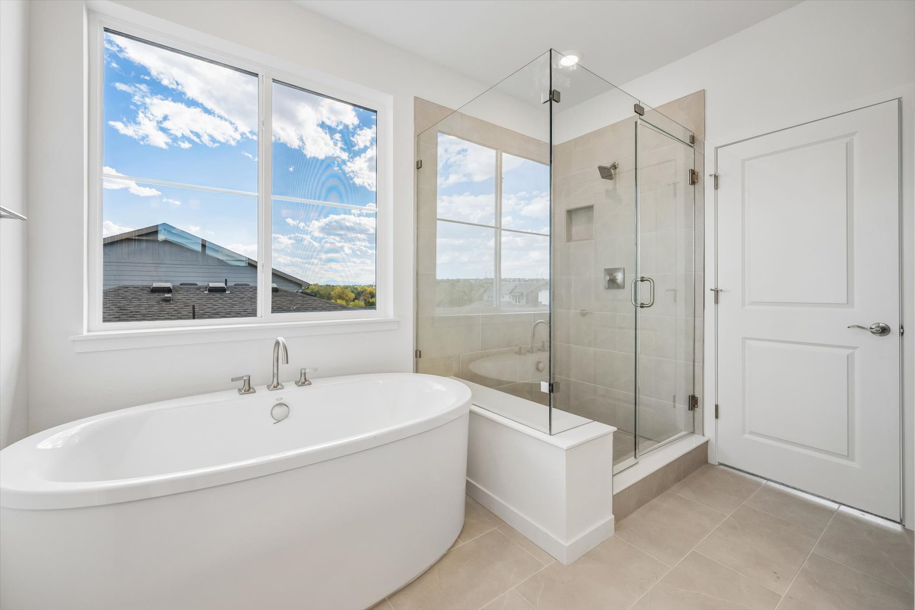 A bathroom with a large window.