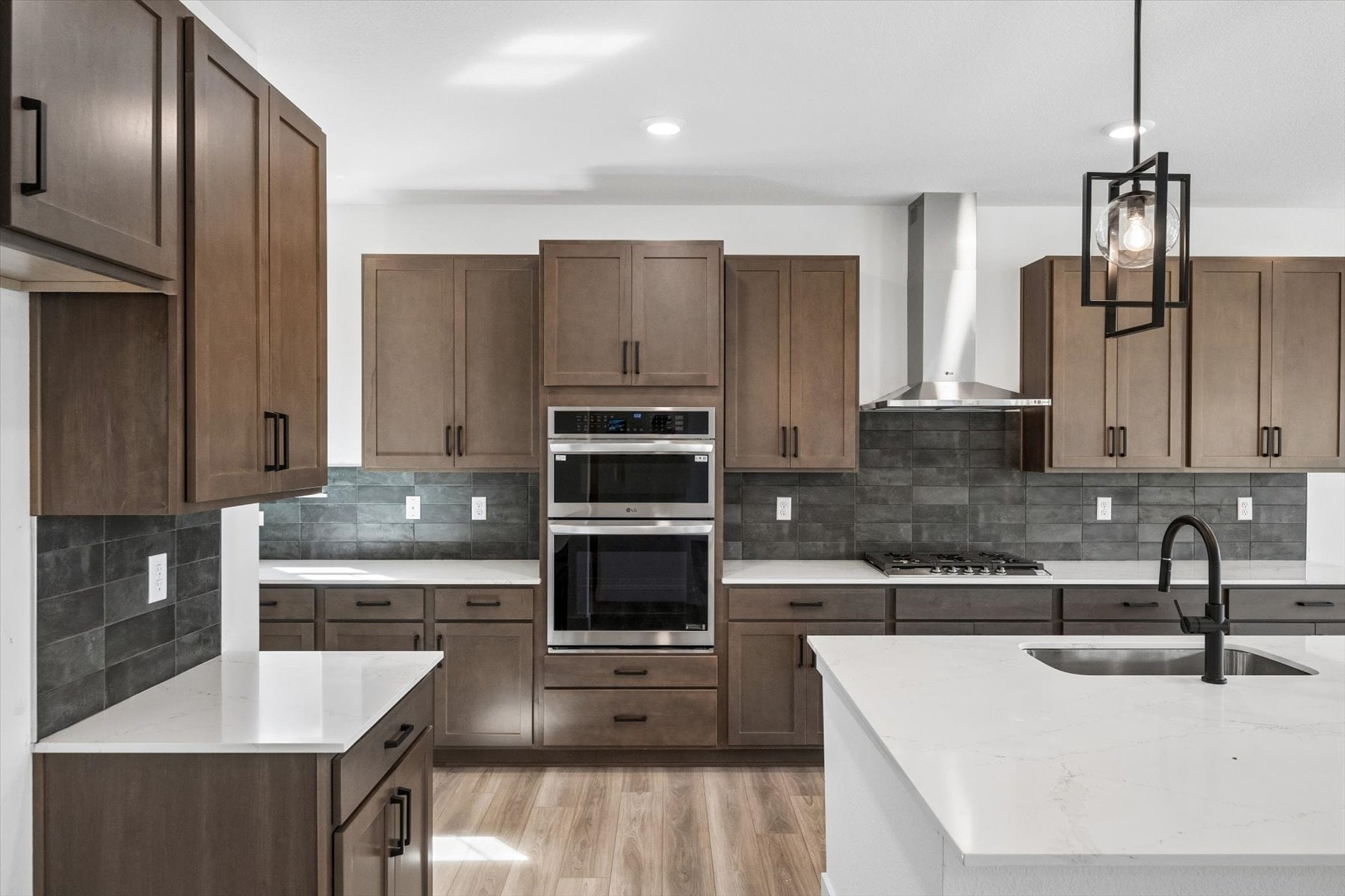 A kitchen with wooden cabinets.