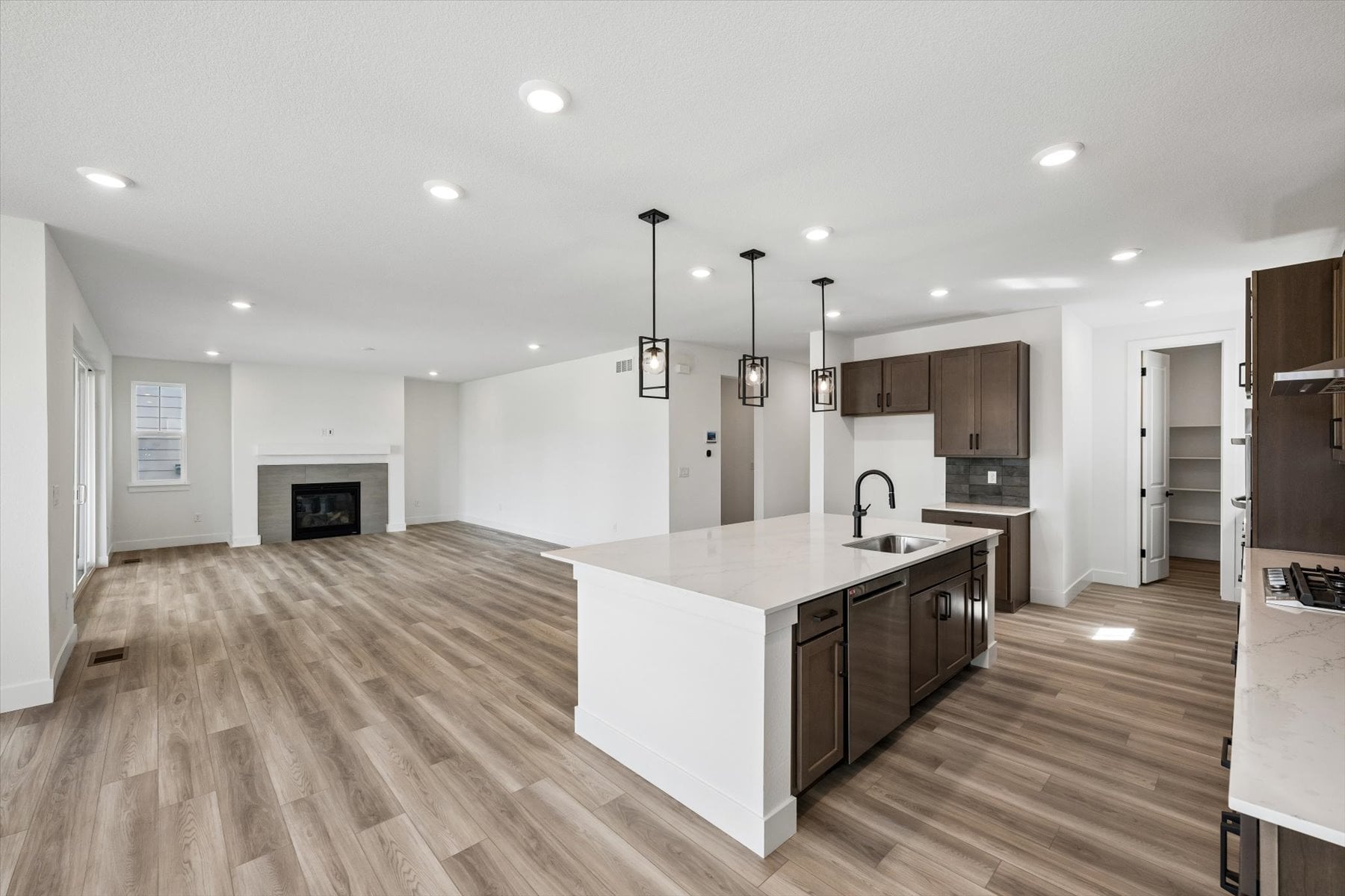 A kitchen with wooden floors.