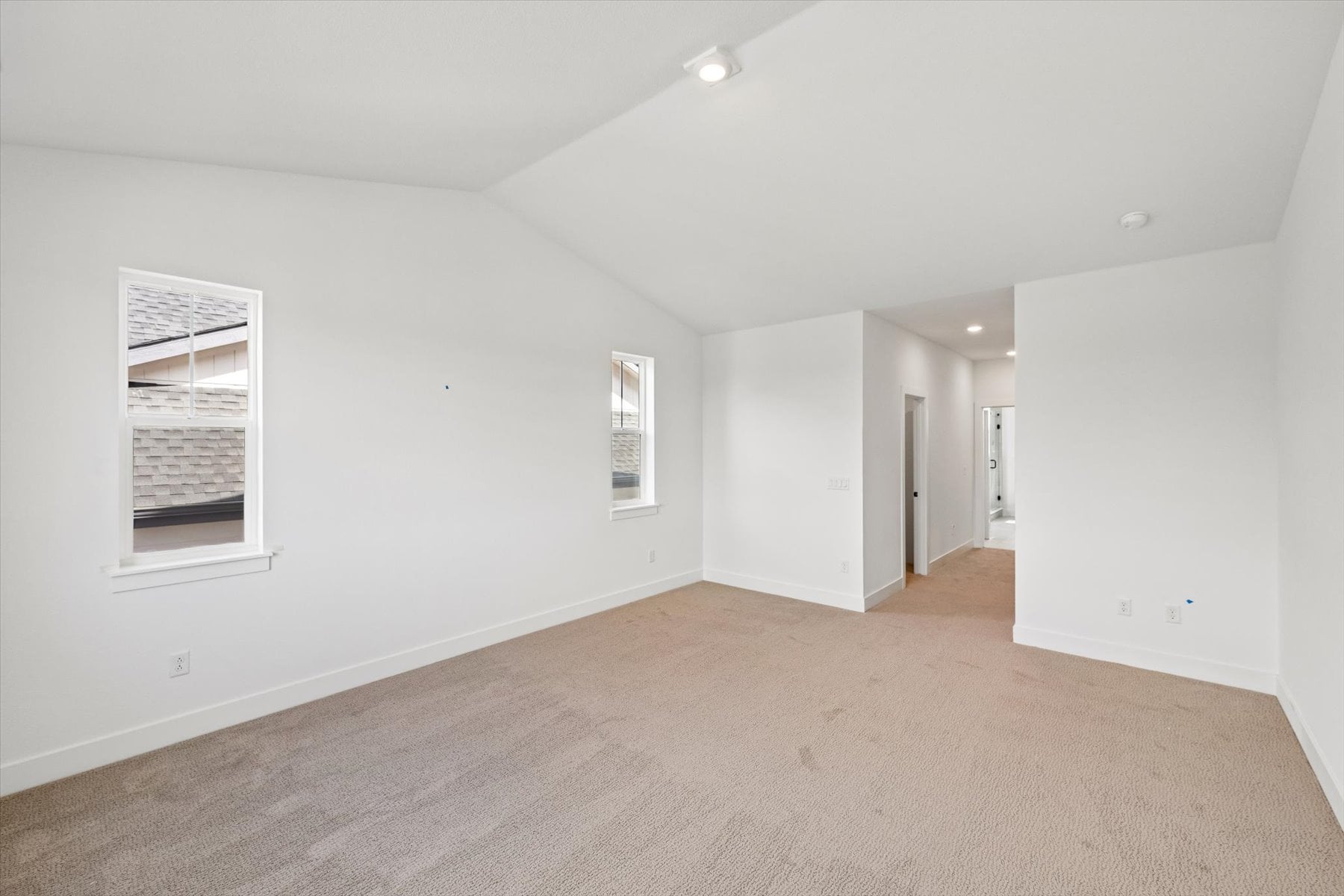 A long hallway with white walls.