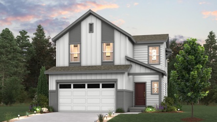 A house with a garage and trees around it.