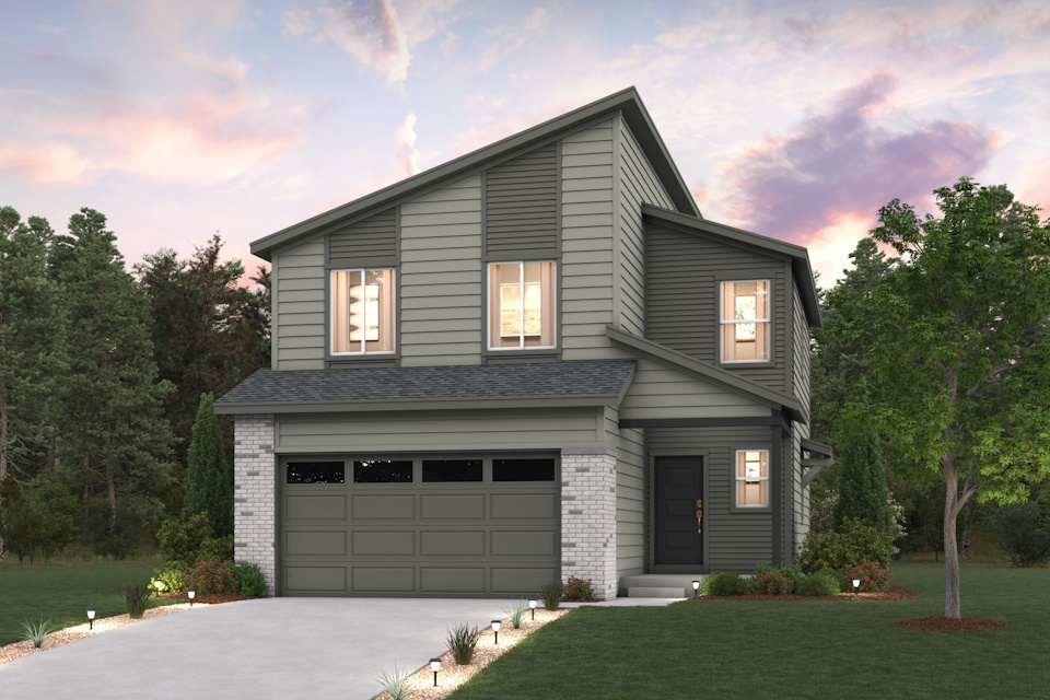 A house with a garage and trees in the back.