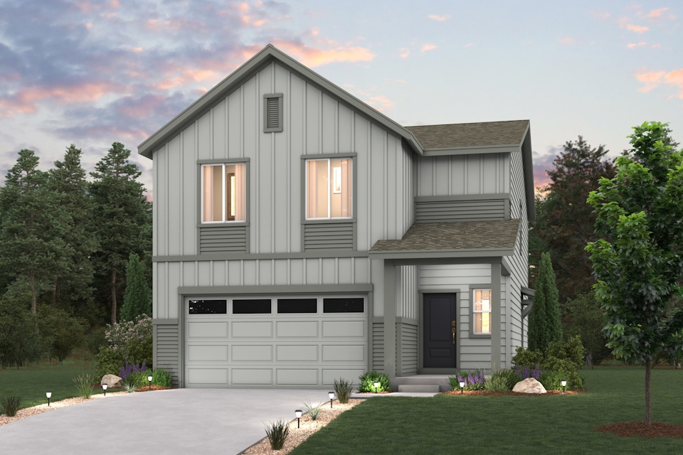 A house with a garage and trees.