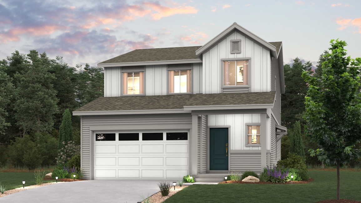A house with a garage and trees.