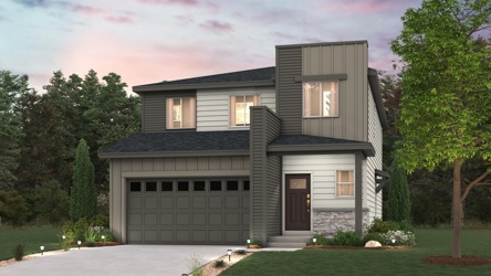 A house with a driveway and trees.