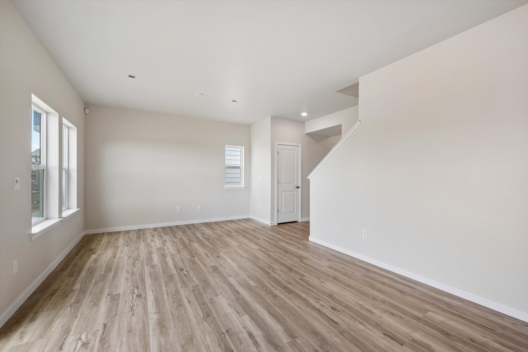 A room with a wood floor and a wood floor.