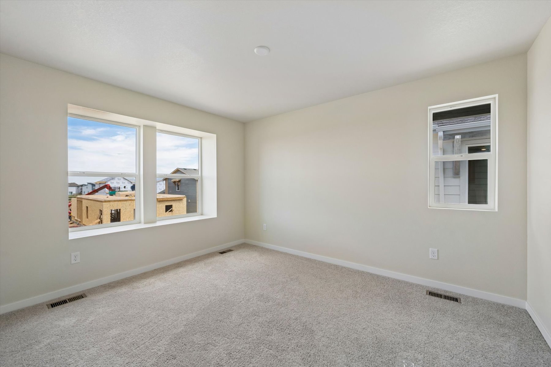 A room with a window and a view of the water.