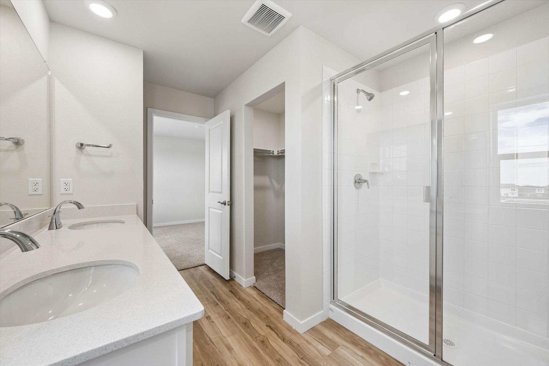 A bathroom with a glass shower.