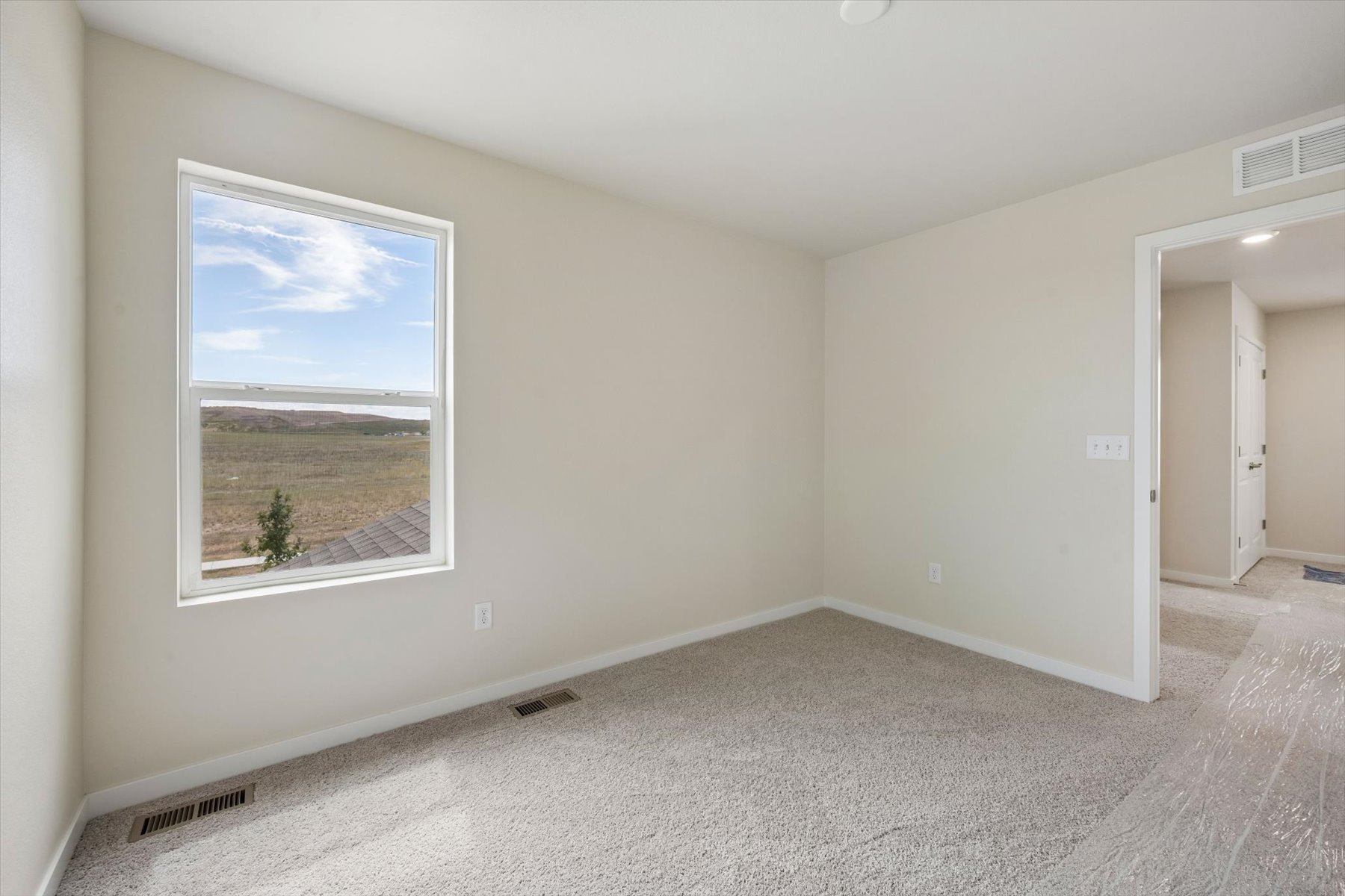 A room with a large window.