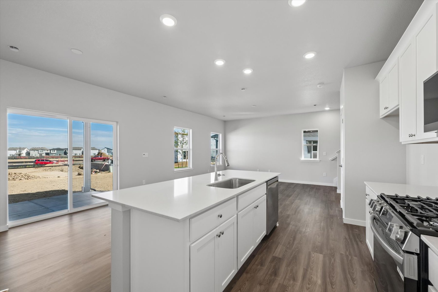 A kitchen with a large glass door.