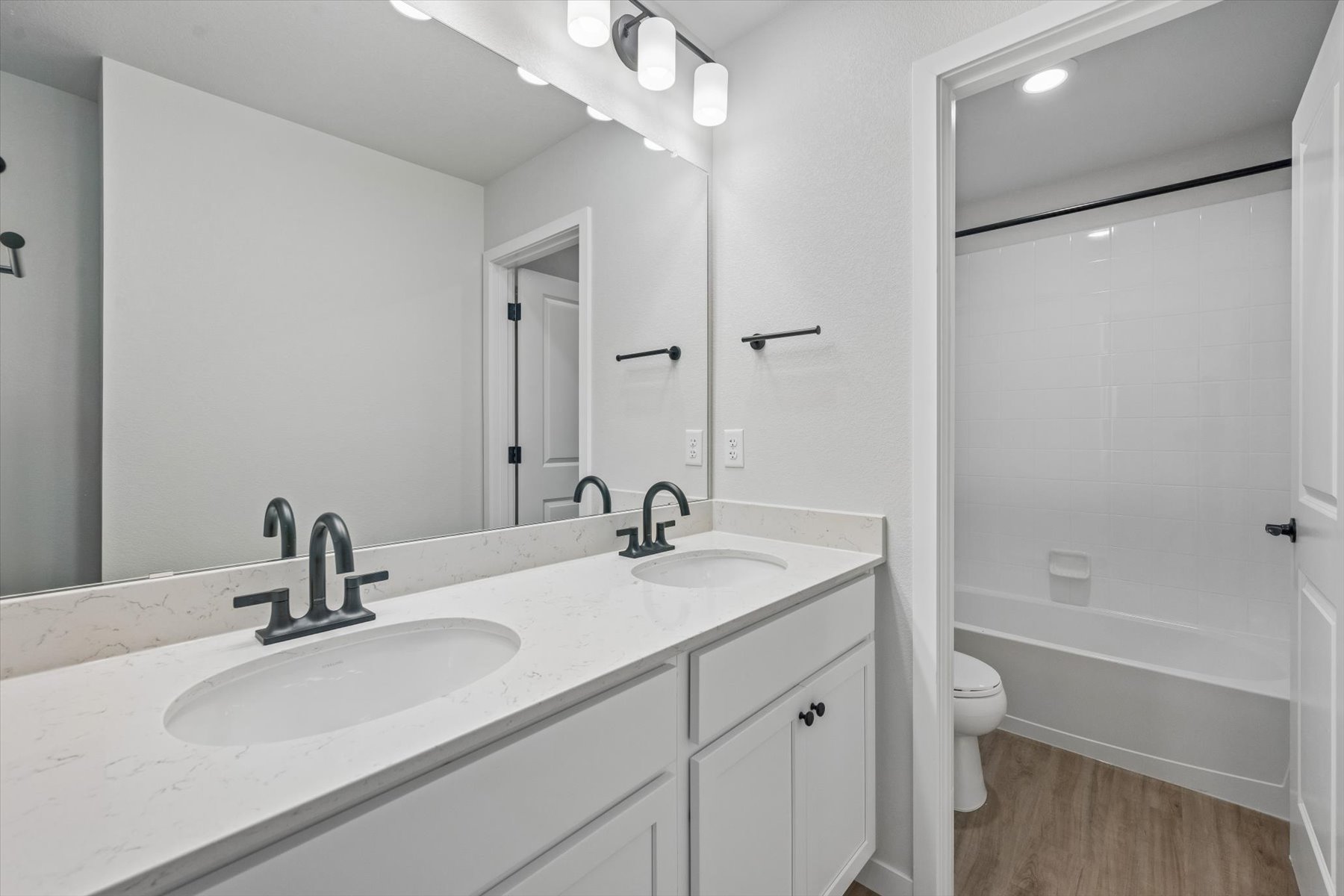 A bathroom with a sink and a toilet.