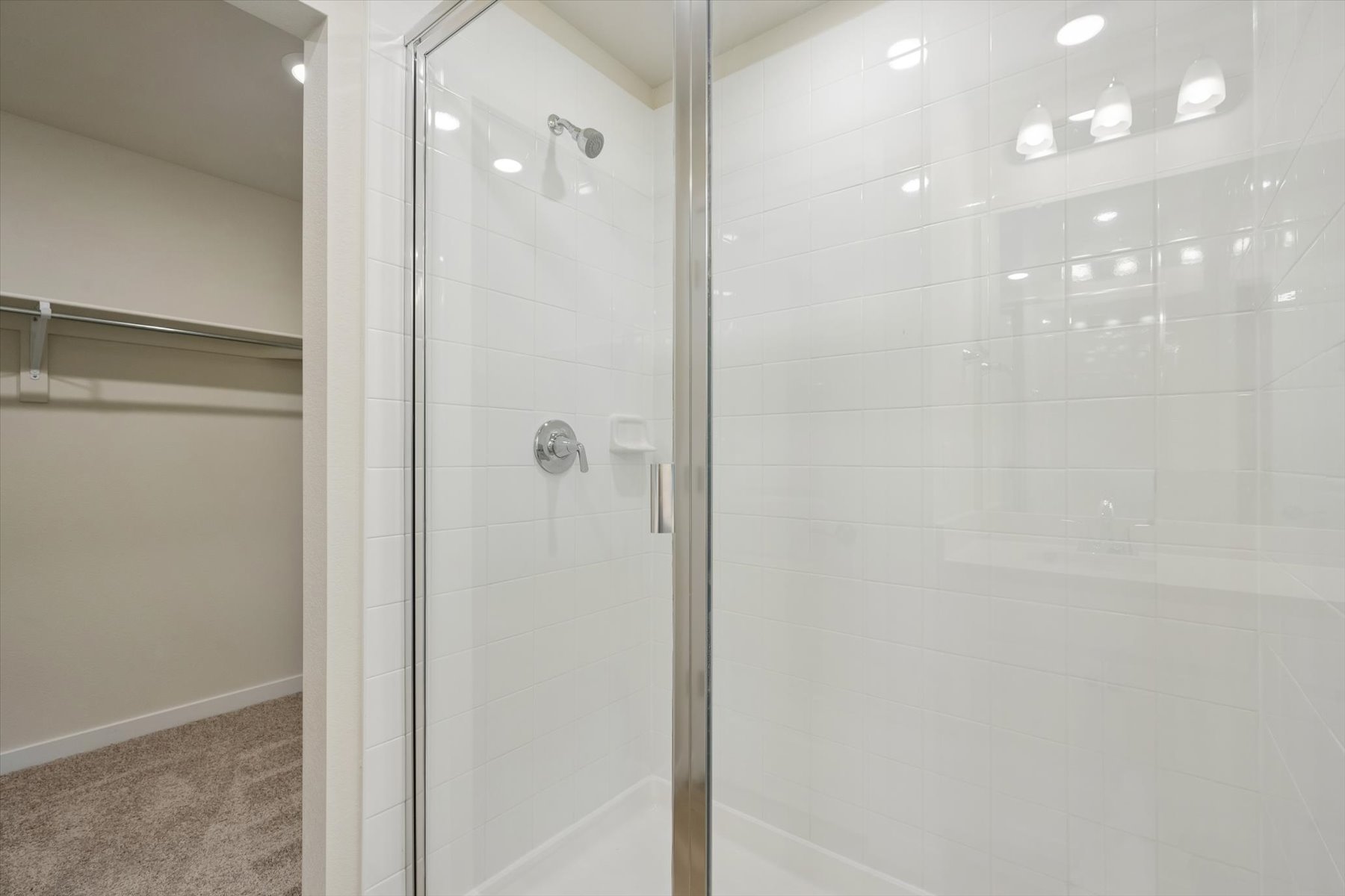 A shower with a glass door.