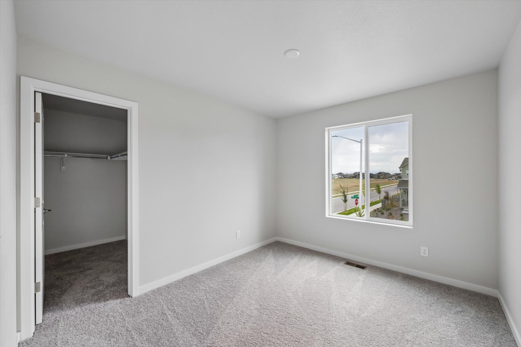 A room with a window and a door.