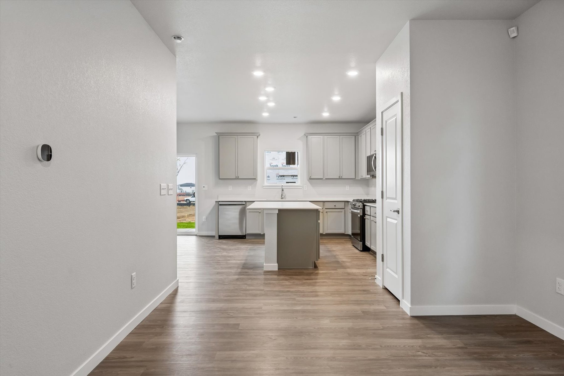 A kitchen with white walls.