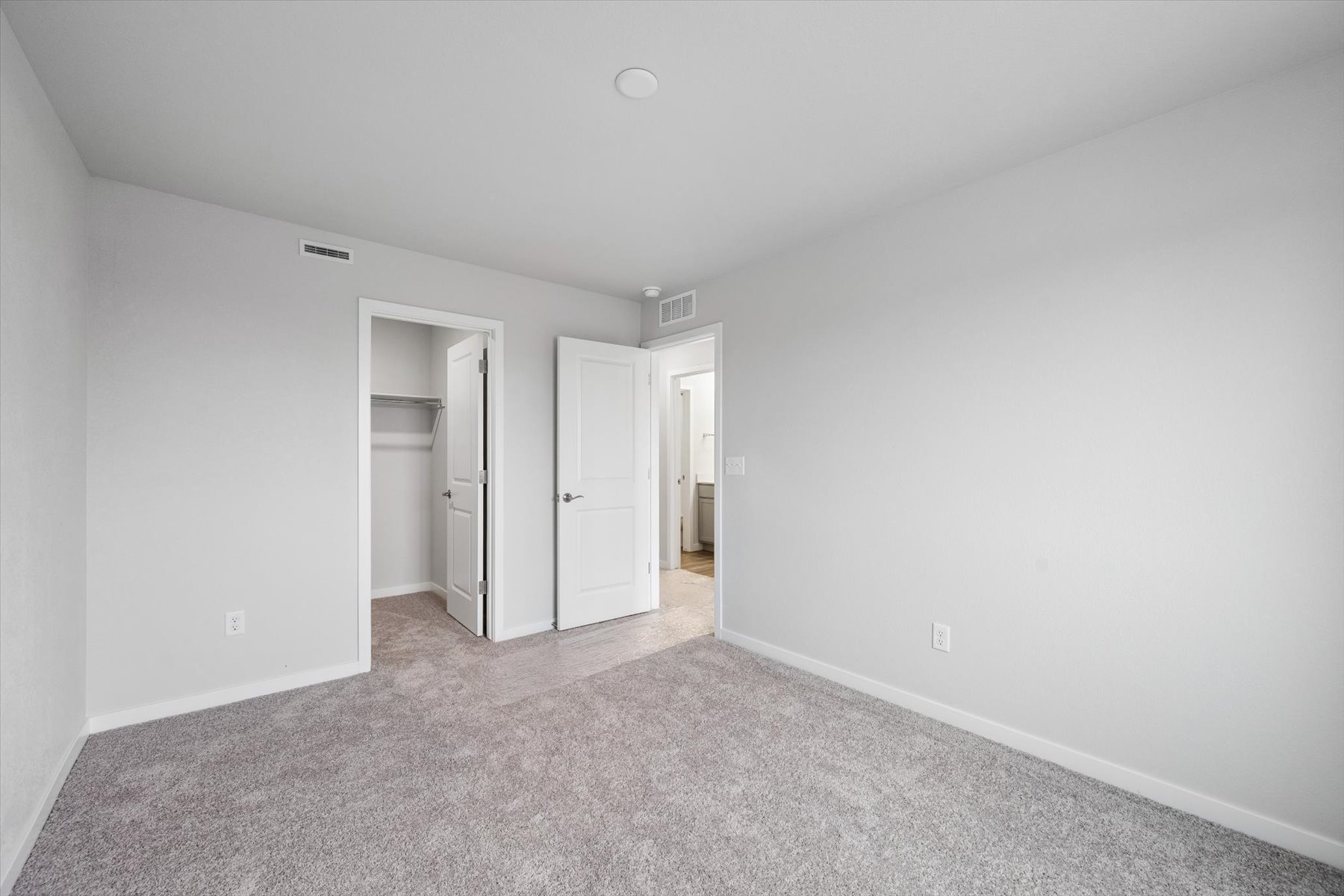 A hallway with white walls.
