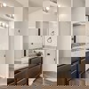 Owner's private bath with dual vanity and walk in closet of the ranch style Telluride plan by Century Communities