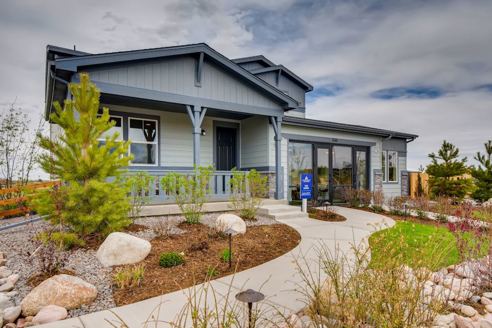 A house with a gravel driveway.