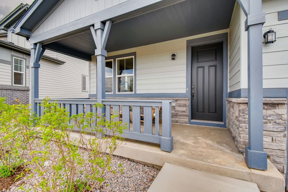 A house with a deck and a door.