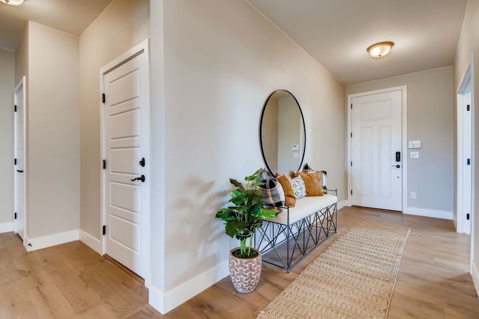 A room with a mirror and a table.