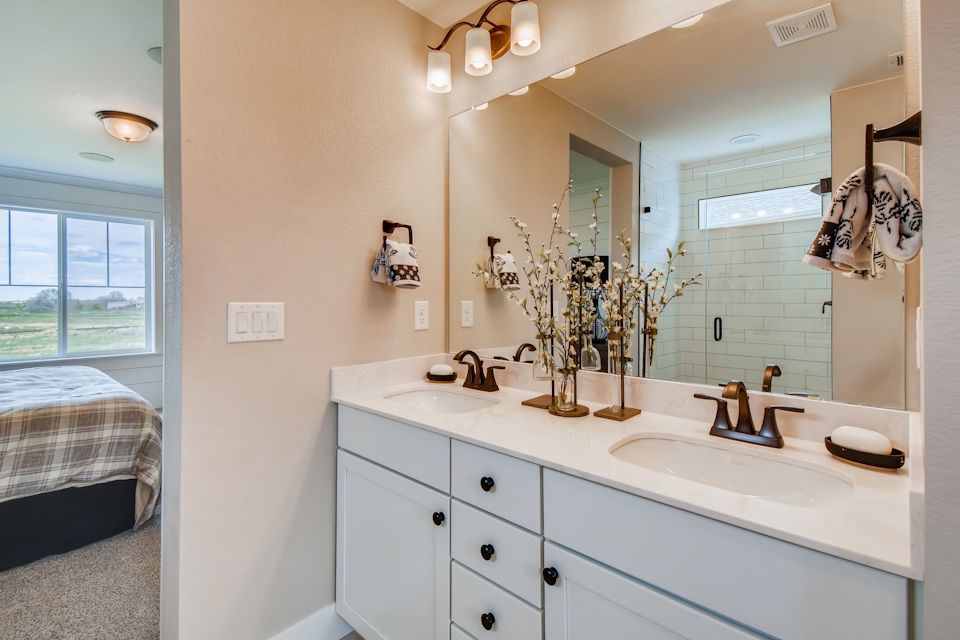 A bathroom with a large mirror.