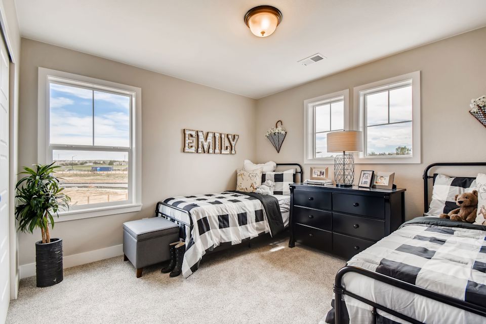 A bedroom with two beds.