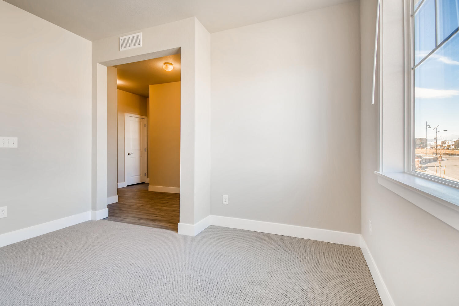 A hallway with a window.