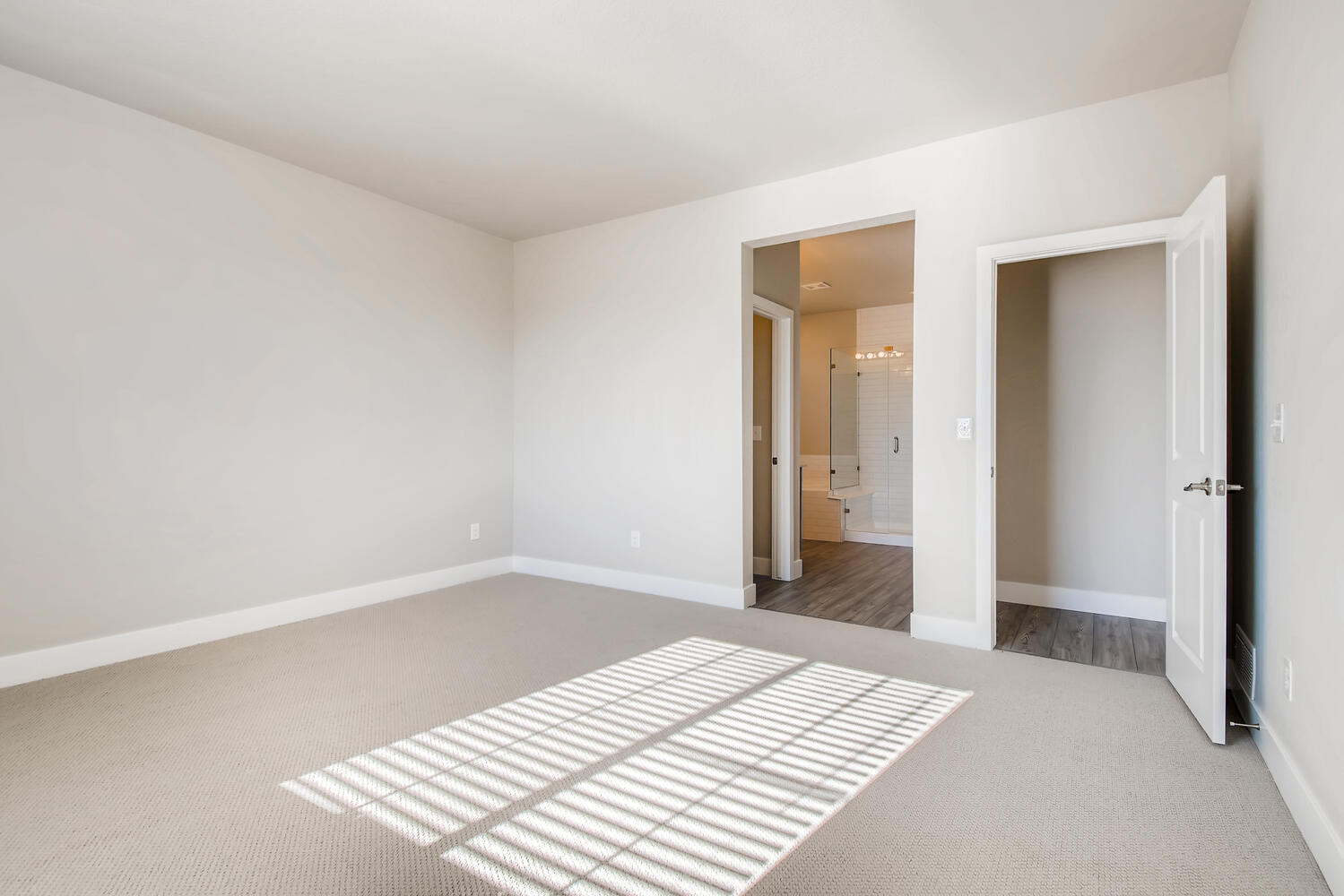 A hallway with white walls.