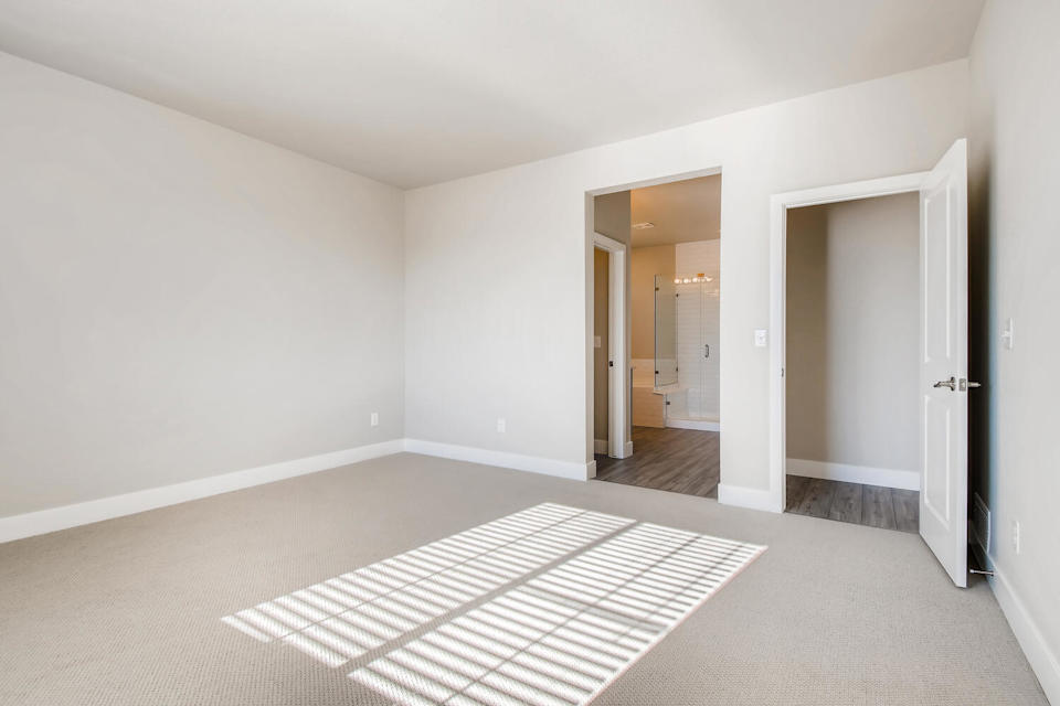 A hallway with white walls.