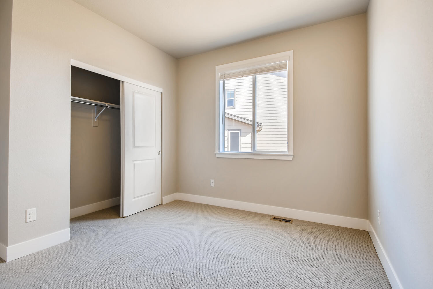 A room with a door and a window.