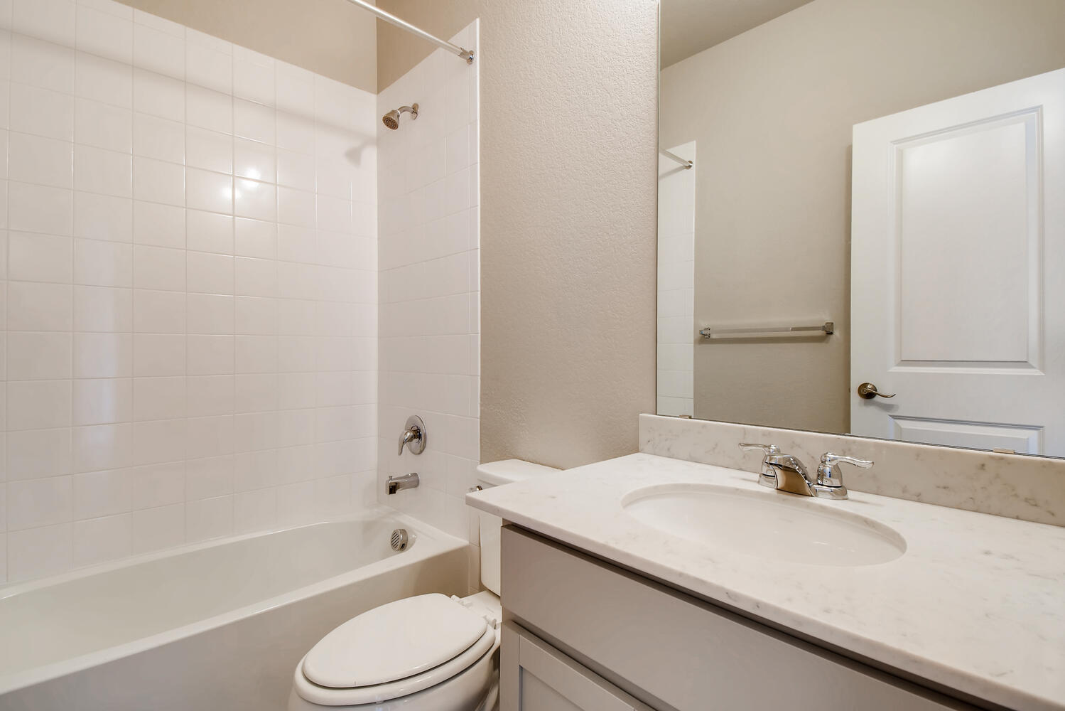 A bathroom with a sink and a toilet.