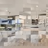 Kitchen in Cornell II plan at The Outlook at Southshore by Century Communities