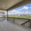 Balcony-style deck in Cornell II plan at The Outlook at Southshore by Century Communities