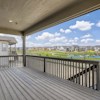 Balcony-style deck in Cornell II plan at The Outlook at Southshore by Century Communities