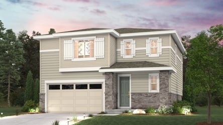 A house with a garage and trees.