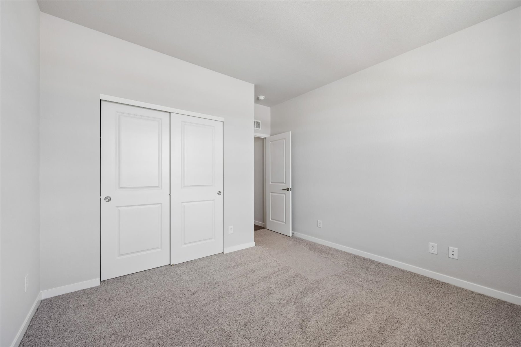 A room with white doors.